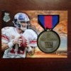 rp_Eli-Manning-Medal-A-300x225.jpg
